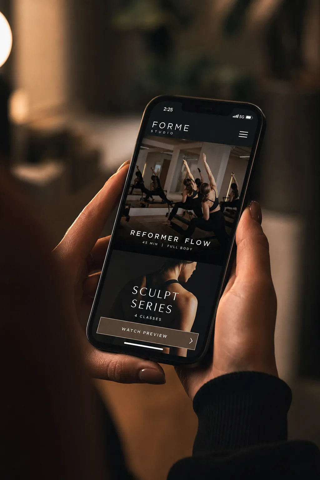 Hands holding a smartphone with pricing details on screen